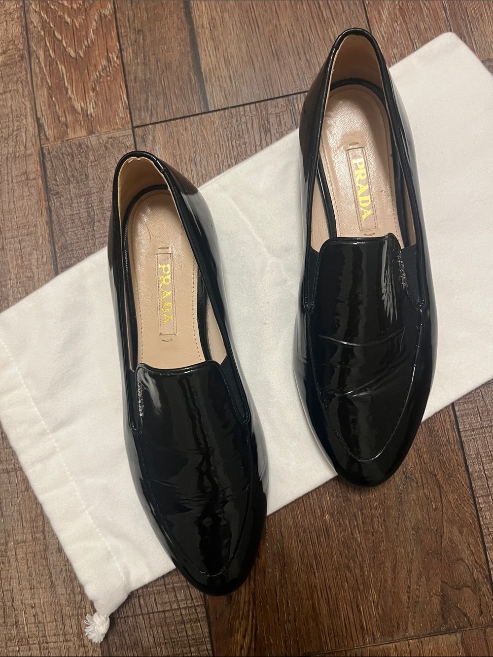Prada Black Patent Leather Slip-On Loafers with Gold Logo